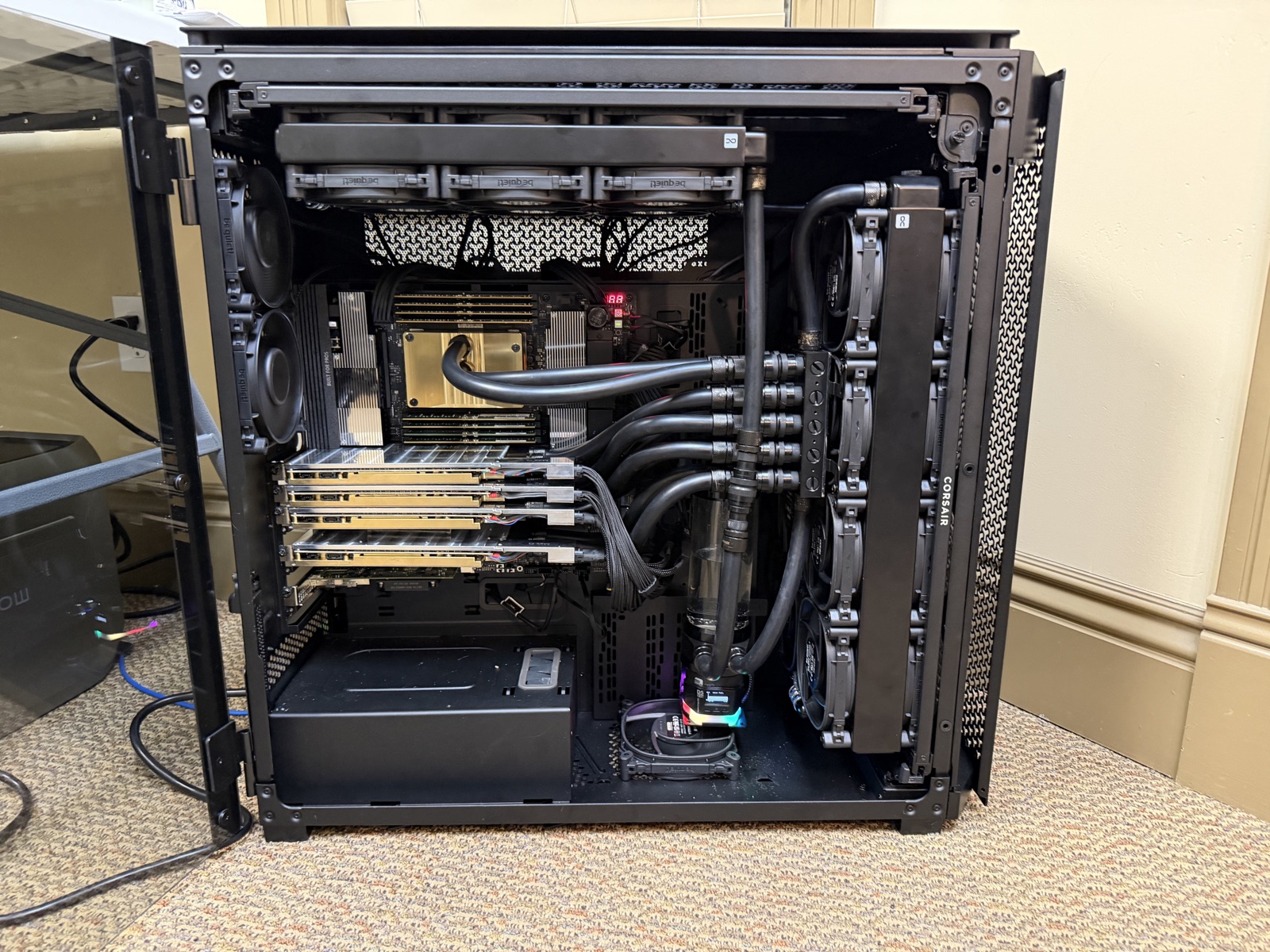 workstation-2 as it runs now — glass off, four cards, the Mellanox card down low