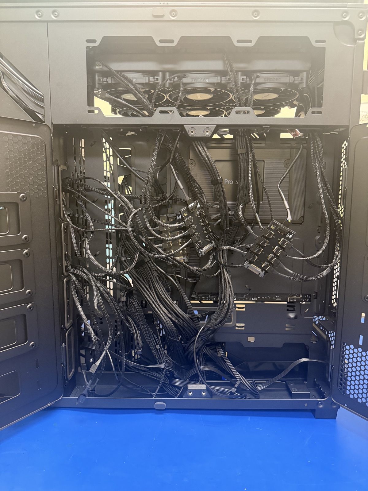 The back of the tray, where all those fan cables land
